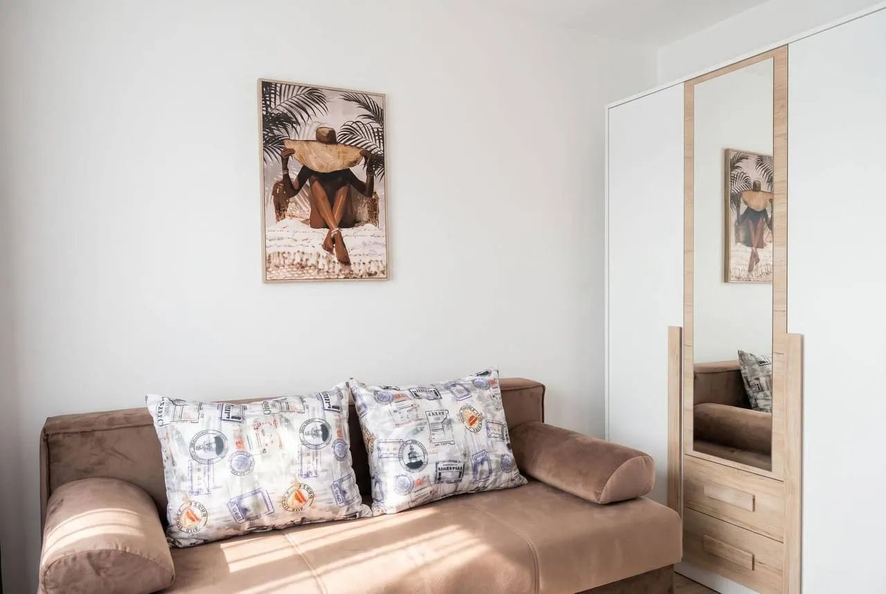 Living room with a sofa and wardrobe.