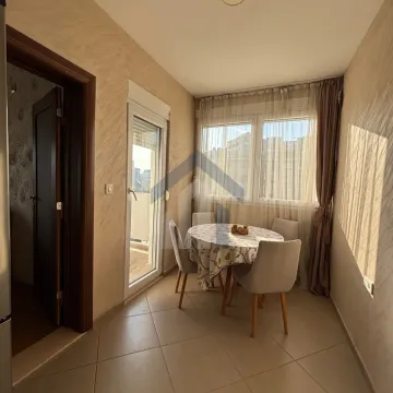 Dining area with a table, chairs, and access to the terrace. - image 8