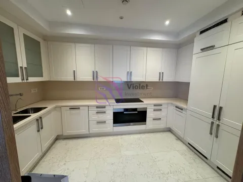 Modern white U-shaped kitchen with built-in appliances. - image 15