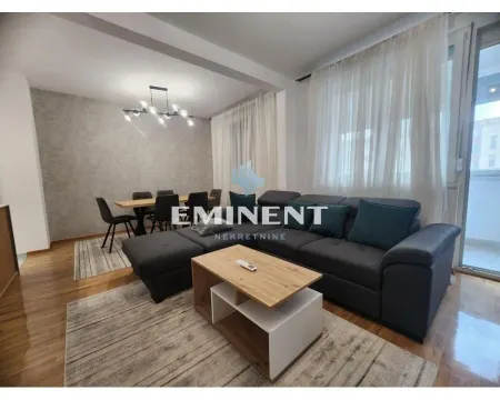 Spacious living room with sofa set and dining area. - image 2