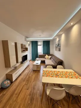 Living room with dining area and modern furniture. - image 9