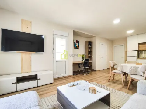 Living room with dining area and TV unit. - image 14