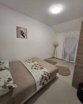 Furnished bedroom with a double bed and access to the terrace. - image 10