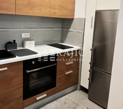 Modern kitchen with wooden elements and built-in appliances. - image 6
