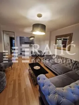Spacious living room with a sofa set and dining area in the background. - image 6