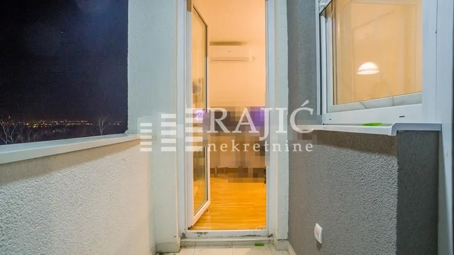 View from the terrace towards the entrance door of the apartment.