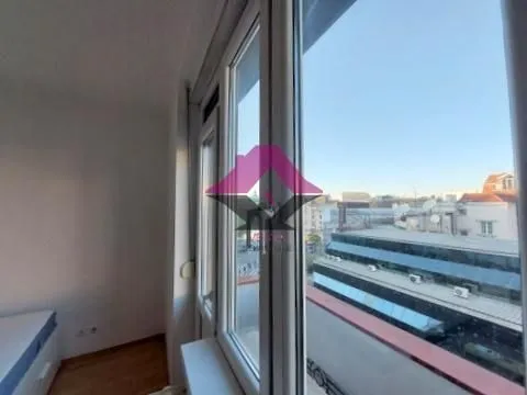 View through the window of surrounding buildings and the city street. - image 8