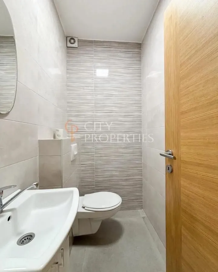 Small bathroom with a sink and toilet.