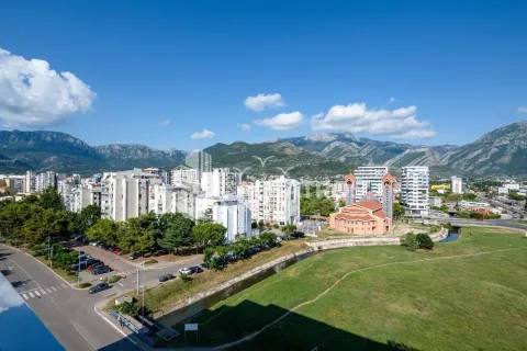 View from the terrace overlooking the city and surrounding mountains. - image 6