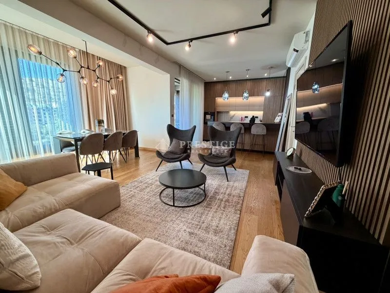 Modern and bright living room connected to the dining area and kitchen.