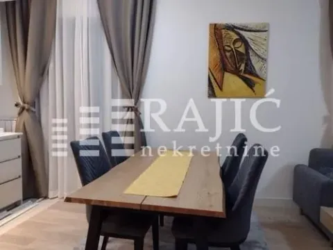 Living room with a dining table and chairs. - image 4