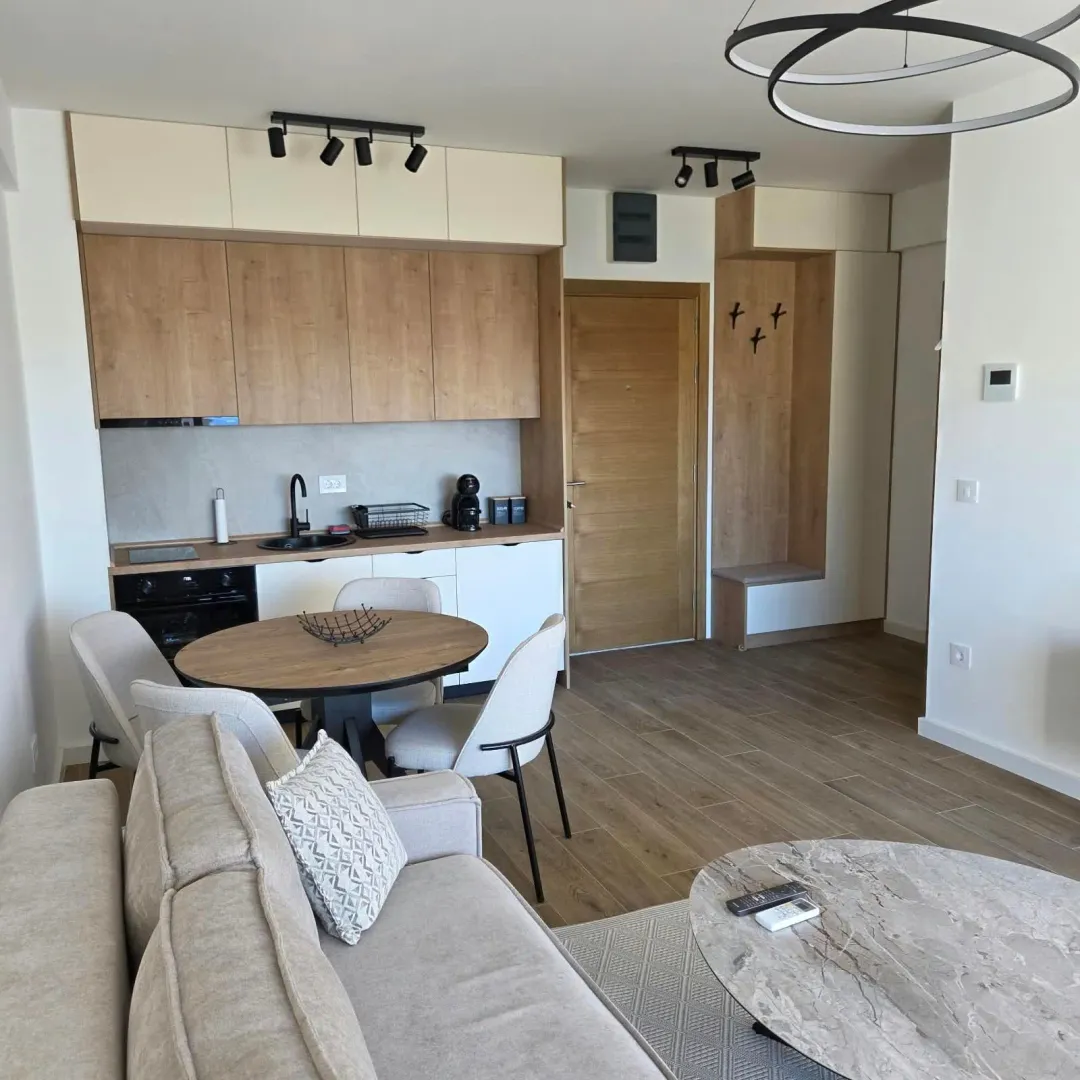 Open-plan living room with kitchen and dining area.
