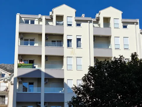 Front view of a multi-story residential building with terraces. - image 8