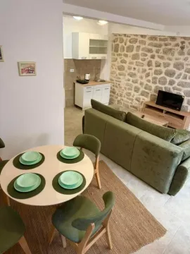 Living room with a dining area and an open layout towards the kitchen. - image 15