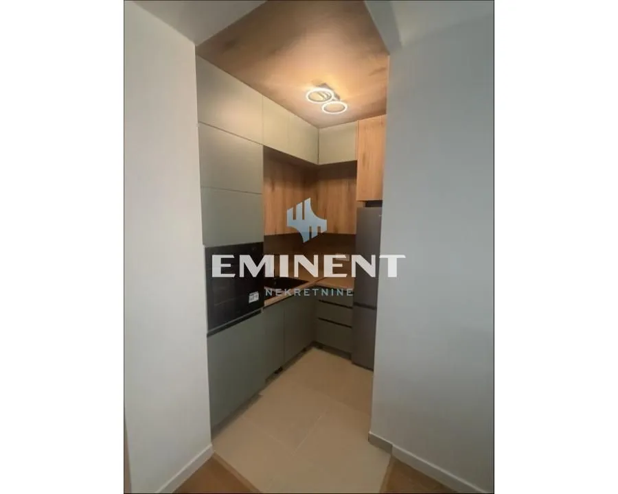 Modern kitchen with built-in cabinetry and appliances.
