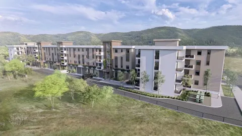 Exterior view of a residential complex with landscaped surroundings. - image 3