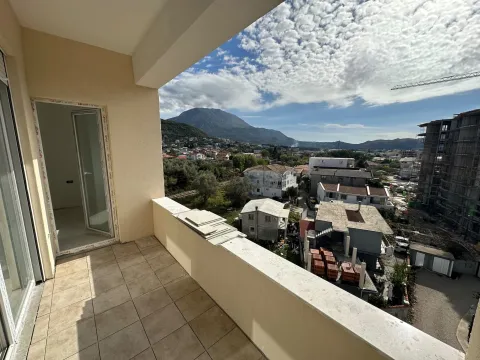 Balcony with a view of the city and mountains. - image 10