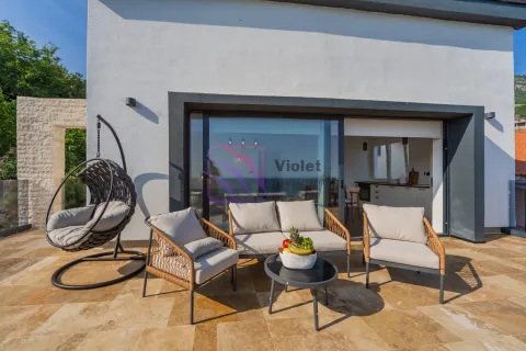 Terrace with outdoor seating furniture and a view of the house interior. - image 7