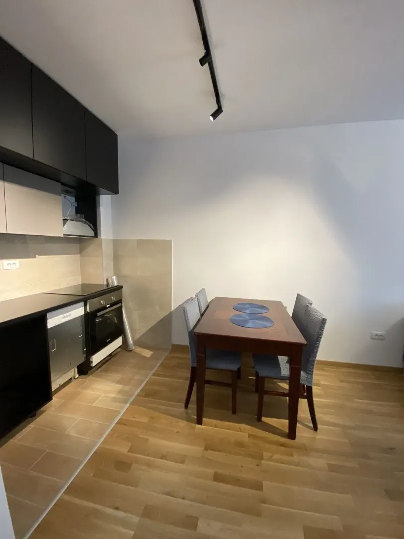 Kitchen with a dining table and chairs.