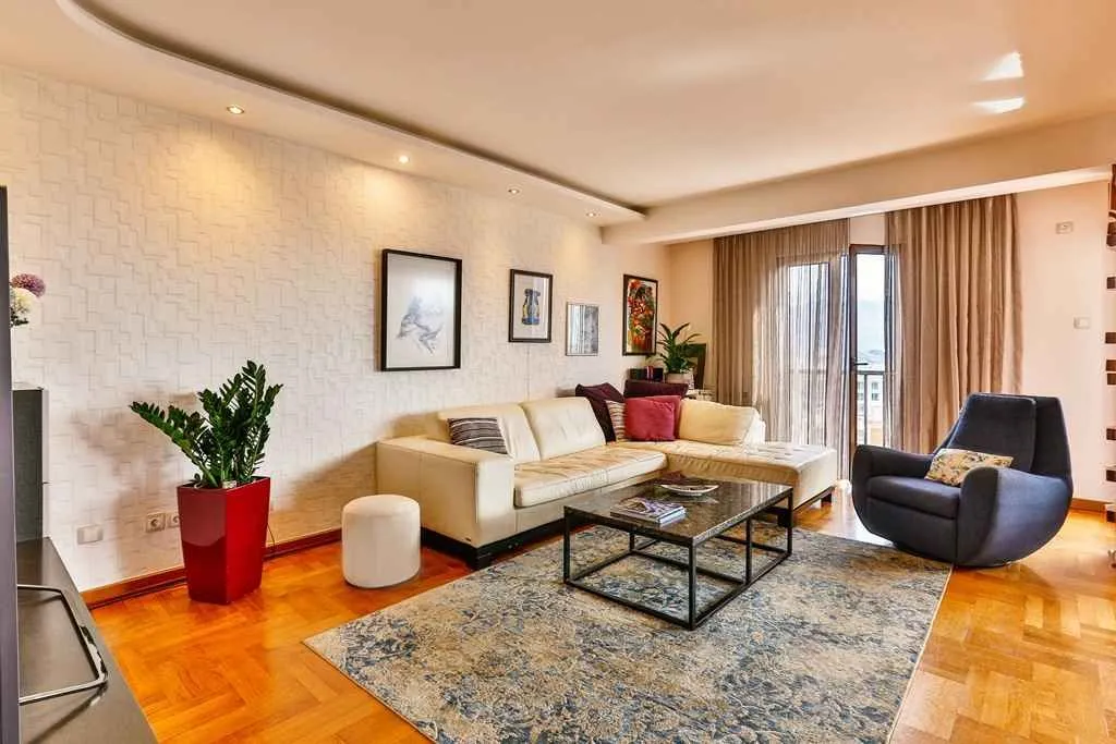 Bright and modernly furnished living room with a corner sofa.