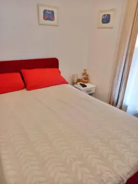 Bedroom with a double bed and a nightstand. - image 3