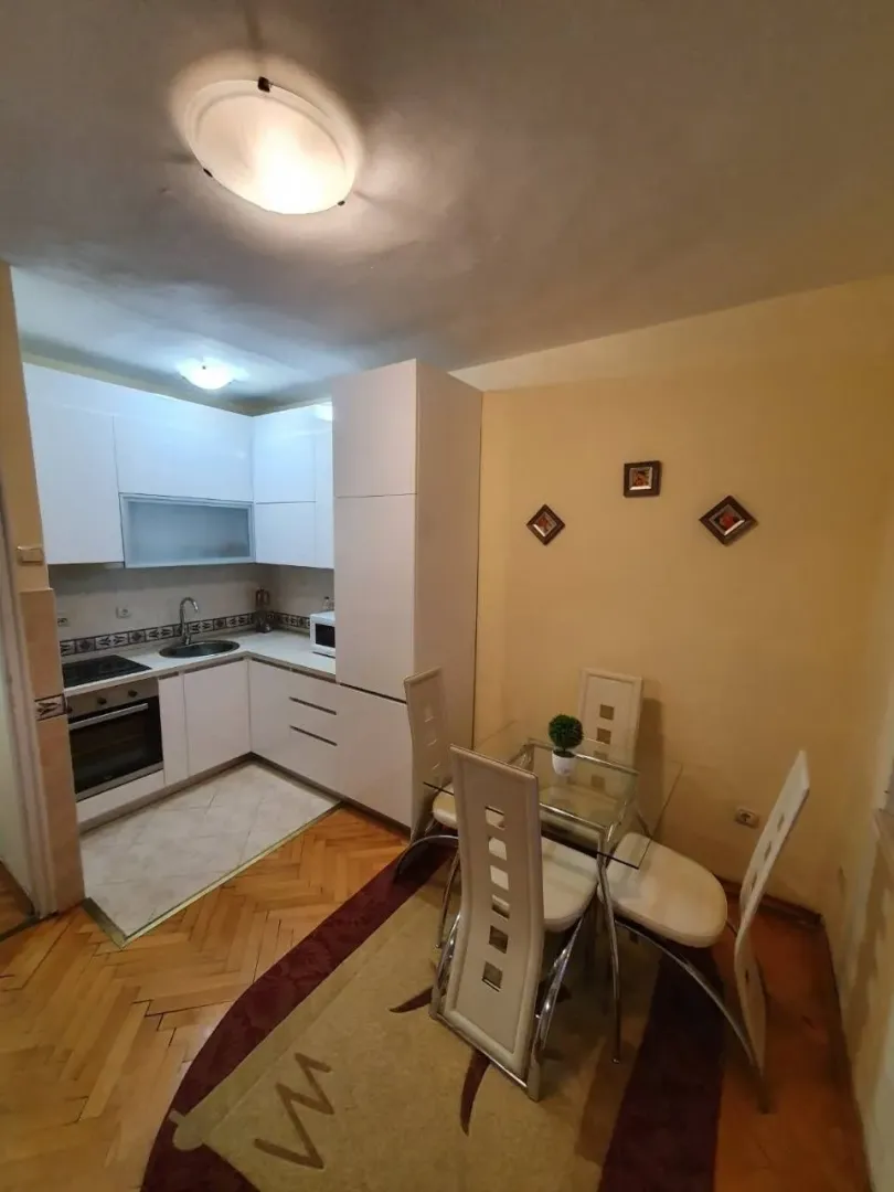 A kitchen with a small dining area.