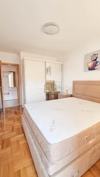 Bedroom with a double bed, wardrobe, and an open door leading to the hallway. - image 4