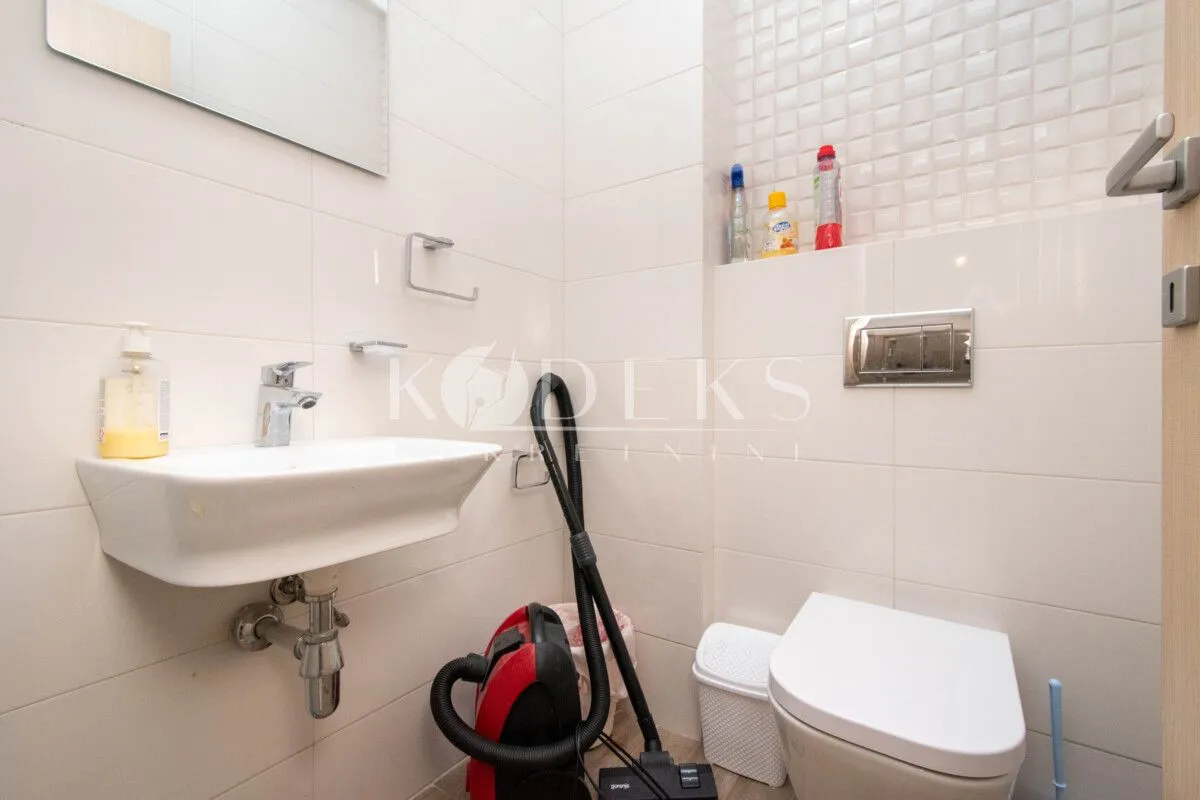 Small bathroom with a sink and toilet.