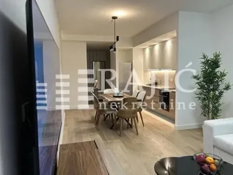 Modern living room with dining area and kitchen in the background. - image 10