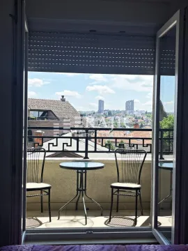 View of the city and surrounding buildings from the terrace. - image 2