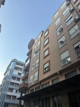 View of the exterior of an apartment building with balconies and windows. - image 7