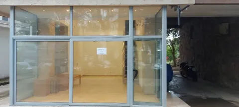View of the commercial space with a large glass storefront. - image 2