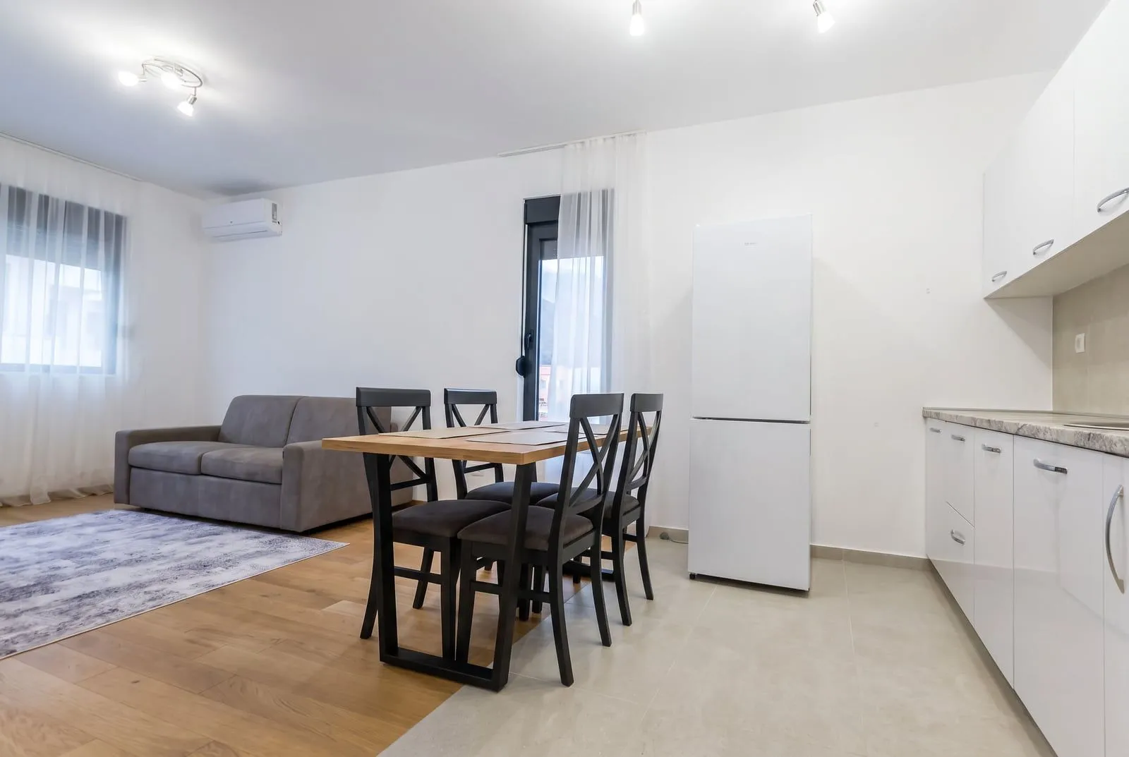 Living room with dining area and kitchen.