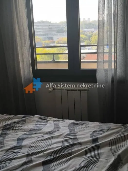 View from the bedroom through the window with curtains.
