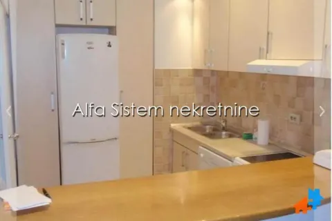 Kitchen with cabinetry and refrigerator. - image 3