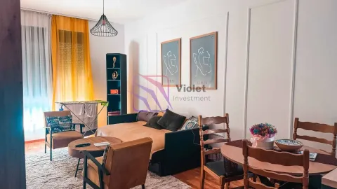 Living room with sofa, coffee table and dining table. - image 5
