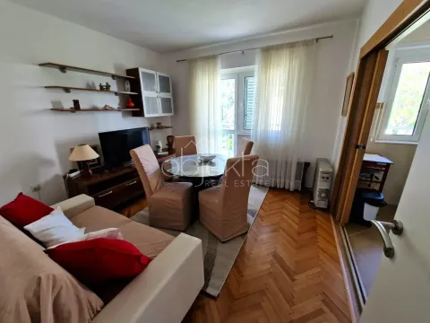 Living room with sofa, TV unit and dining table. - image 2