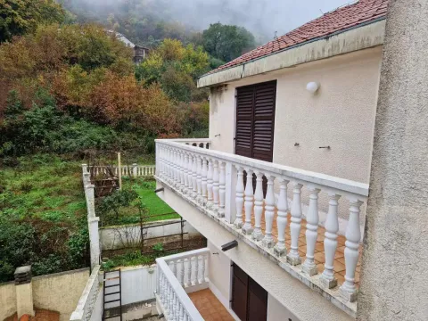 View of the terrace and the yard of the house surrounded by greenery. - image 9