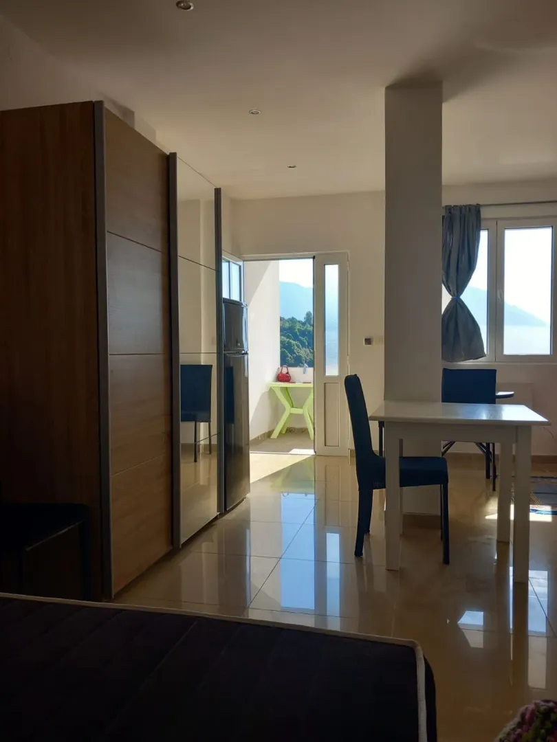 Furnished bedroom with a wardrobe and access to the terrace.
