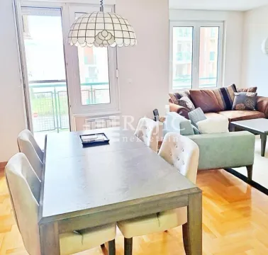 Living room with a dining area and seating set. - image 4