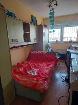 Children's bedroom with a bed, wardrobes, and a desk. - image 11