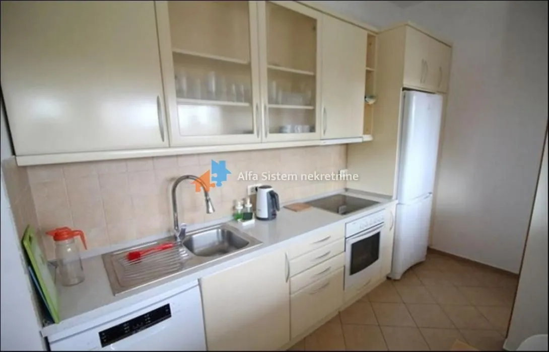 Kitchen equipped with cabinetry and home appliances.