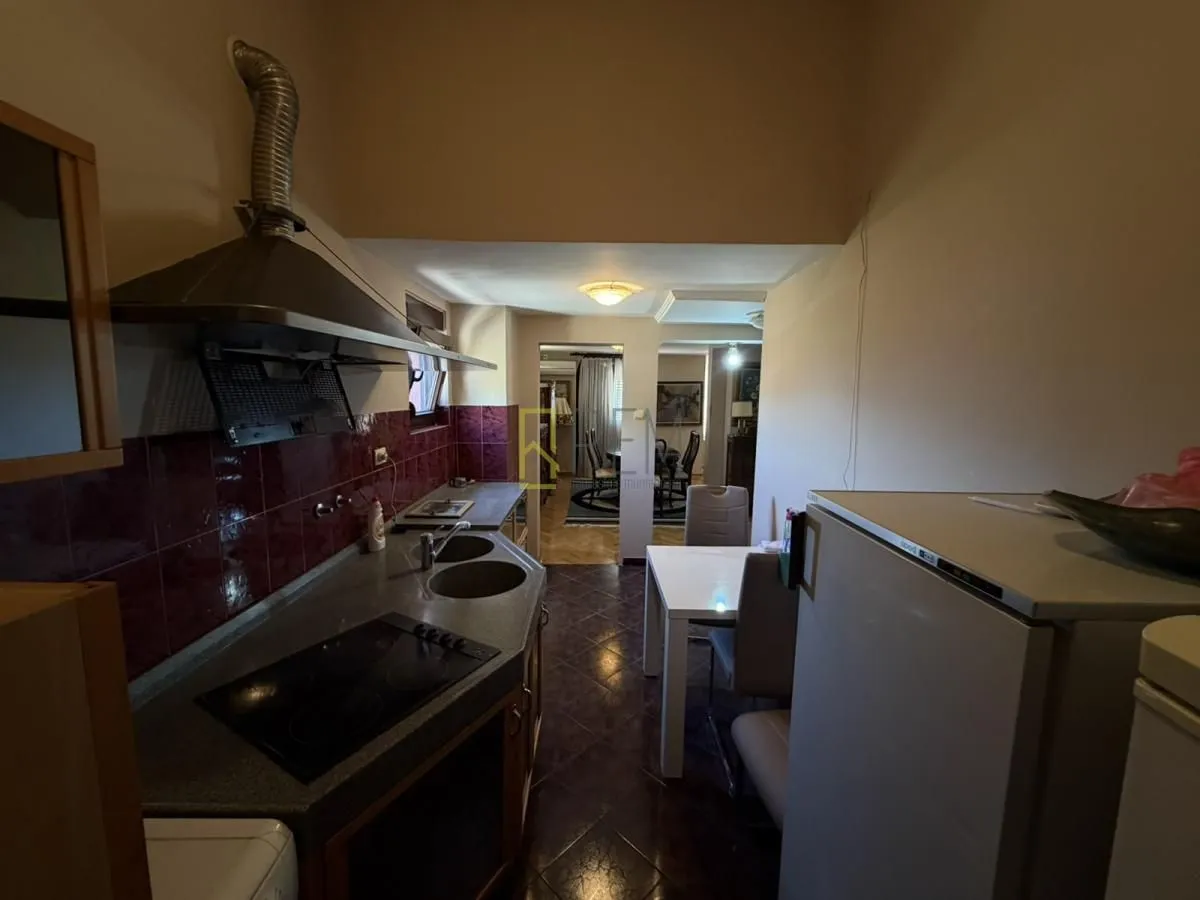 Smaller kitchen with cabinetry and a dining table.