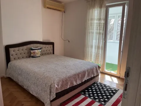 Bright bedroom with a double bed and terrace access. - image 7