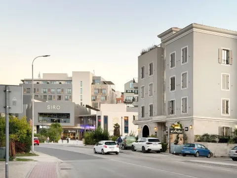 View of the street and modern residential and commercial buildings. - image 2