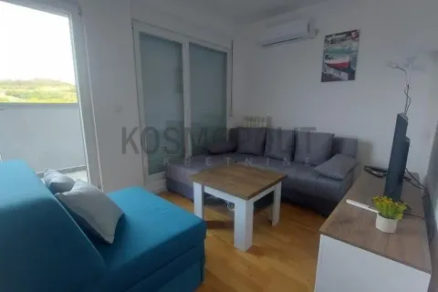Living room with sofa, coffee table and TV. - image 2