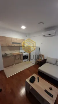 Living room with kitchen and dining area. - image 3