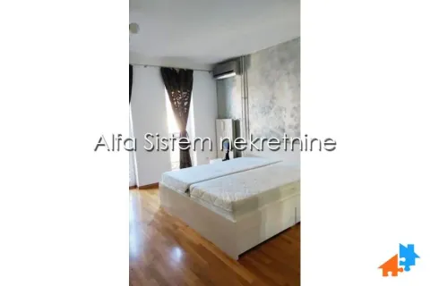 Bedroom with a double bed and wooden flooring. - image 16