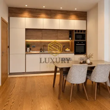 Modern kitchen with dining area and built-in appliances. - image 3