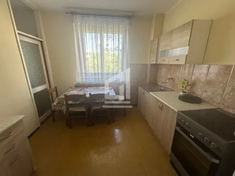 Kitchen with a dining table and window. - image 2